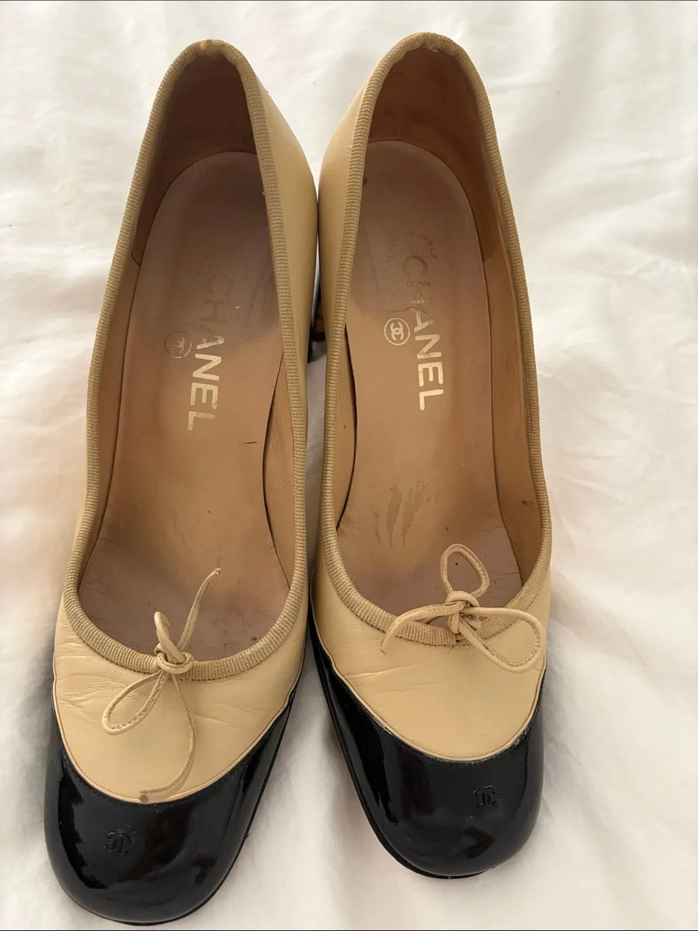 CHANEL Beige and Black Cap-Toe Bow Mid-Heel Pumps